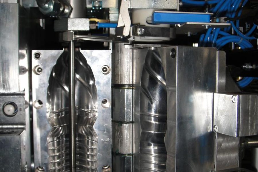 Combi 200 - A PET bottle blowing mould mounted in a PET bottle blowing machine, ready for production.